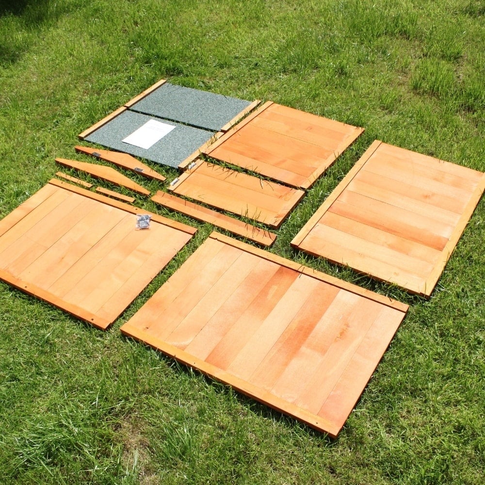 Beehive composter components led on a lawn