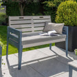 garden grey bench with cushion and book