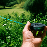 man holding bird scare tape
