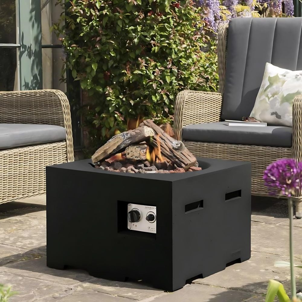 black square firepit cube in centre of wicker furniture