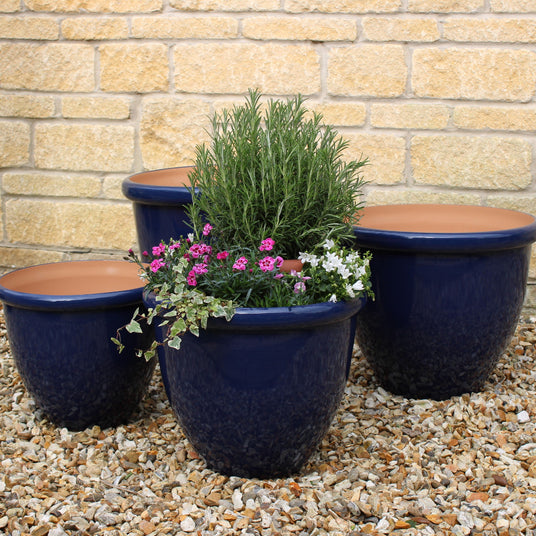 glaze effect blue cotona planter in garden