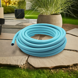 blue garden hose pipe in garden