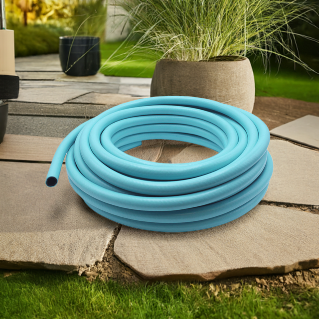 blue garden hose pipe in garden