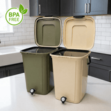 Two trash bins, one green and one beige, on a kitchen counter with a BPA-free label.