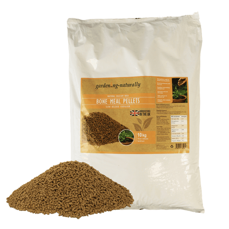 a pile of bone meal pellets next to a bag of bone meal