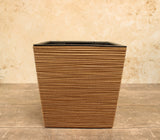 Brown square plant pot with a horizontal ribbed textured finish