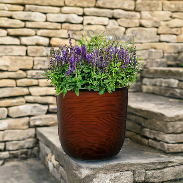 burnt orange flower pot with lavender