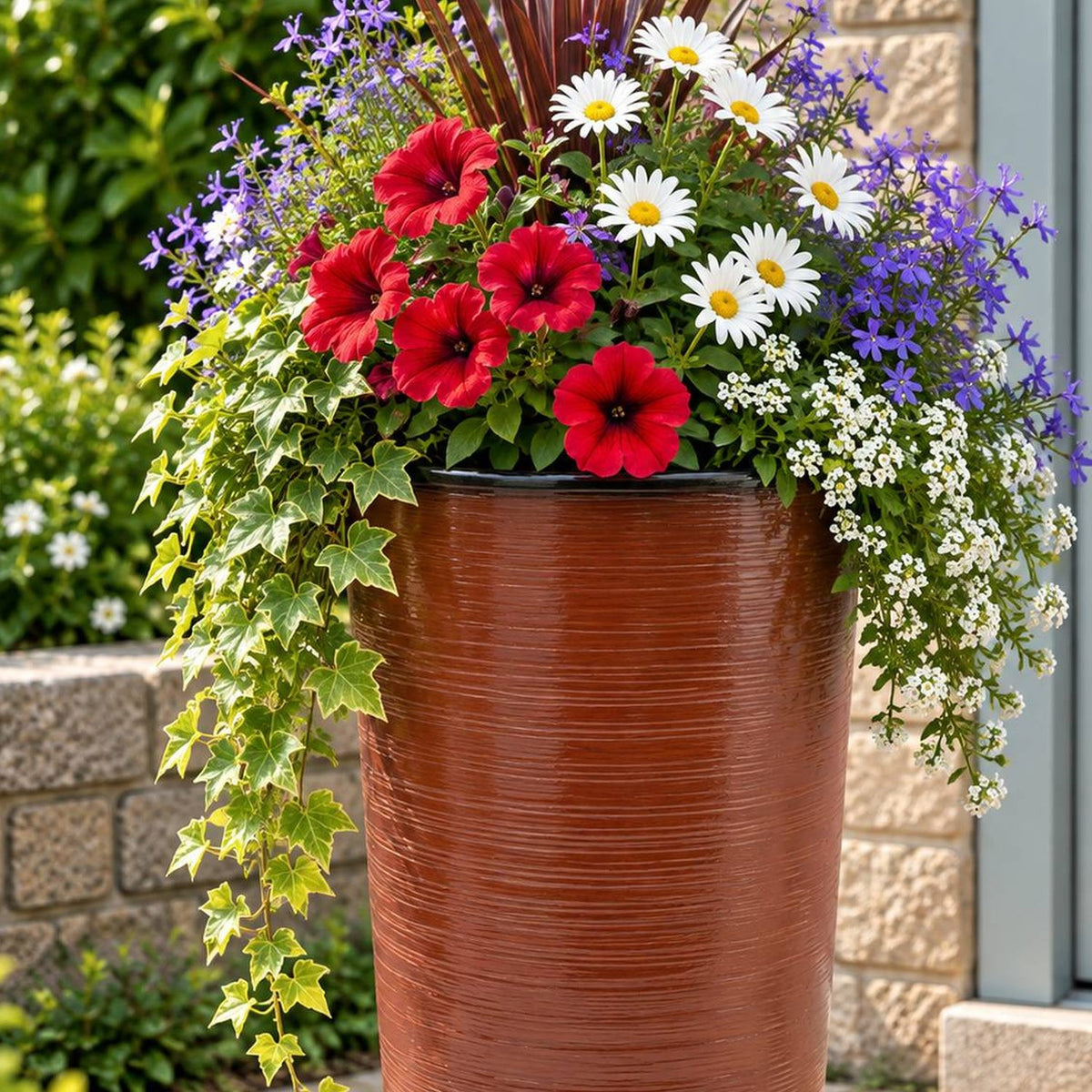 Burnt orange planter with flowers