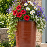 Burnt orange planter with flowers