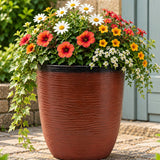 Burnt orange pot with flowers 