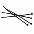 A group of black cable ties arranged on a light background.