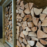 Side view of full log storage cabin