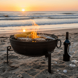 fire bowl on beach by sea