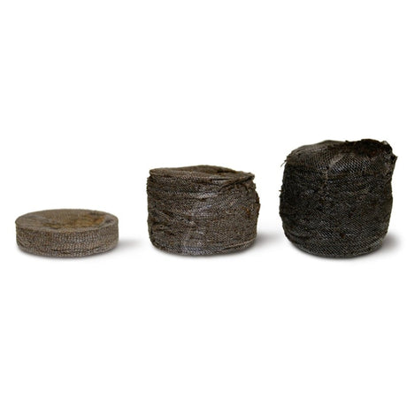 Two compressed coir pellets of different sizes, intended for use in gardening for seed and cutting propagation.