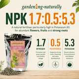 Gardening Naturally fertilizer package with NPK ratio and benefits on a wooden surface.