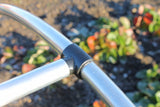 Black connector support bar on a garden cage close up
