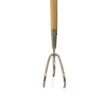Metal garden cultivator with wooden handle on a white background