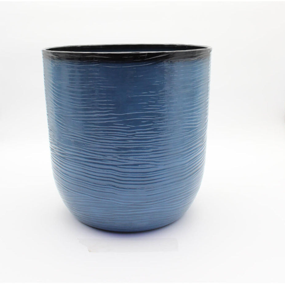 Blue textured flower pot on a white background