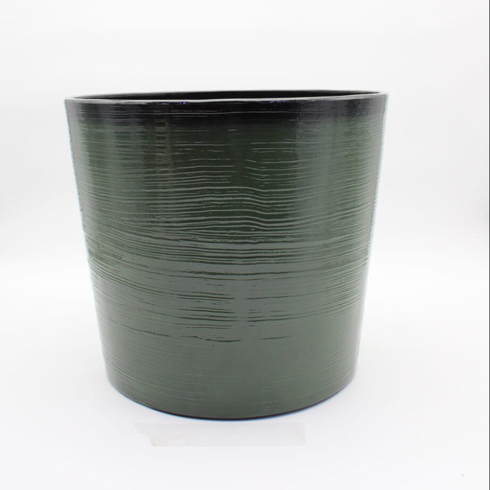 Green textured flower pot on a white background