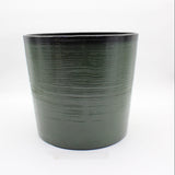 Green textured flower pot on a white background