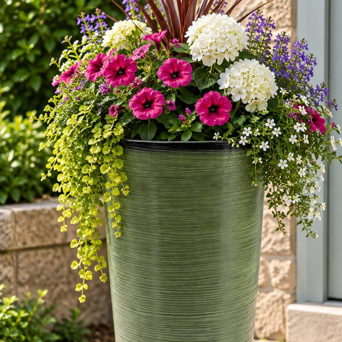 Dark green planter with flowers