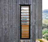 Stained cladding showing eco wood treatment colour