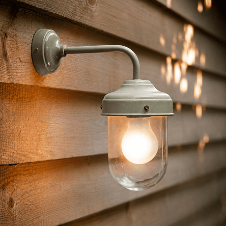 Outdoor wall light fixture on a wooden wall