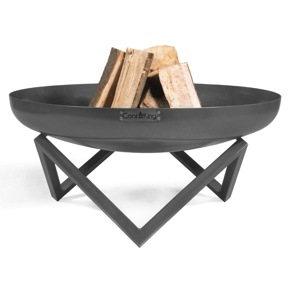 stylish black bowl style firepit with logs on white background