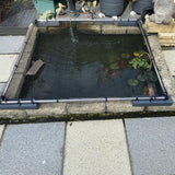 Koi pond with a cover on a patio