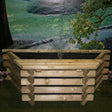 Handcrafted wooden water feature on a solid base, great for landscaping projects.