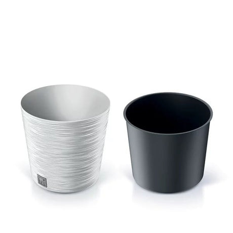 White coloured plant pot with ribbed exterior and an inner pot