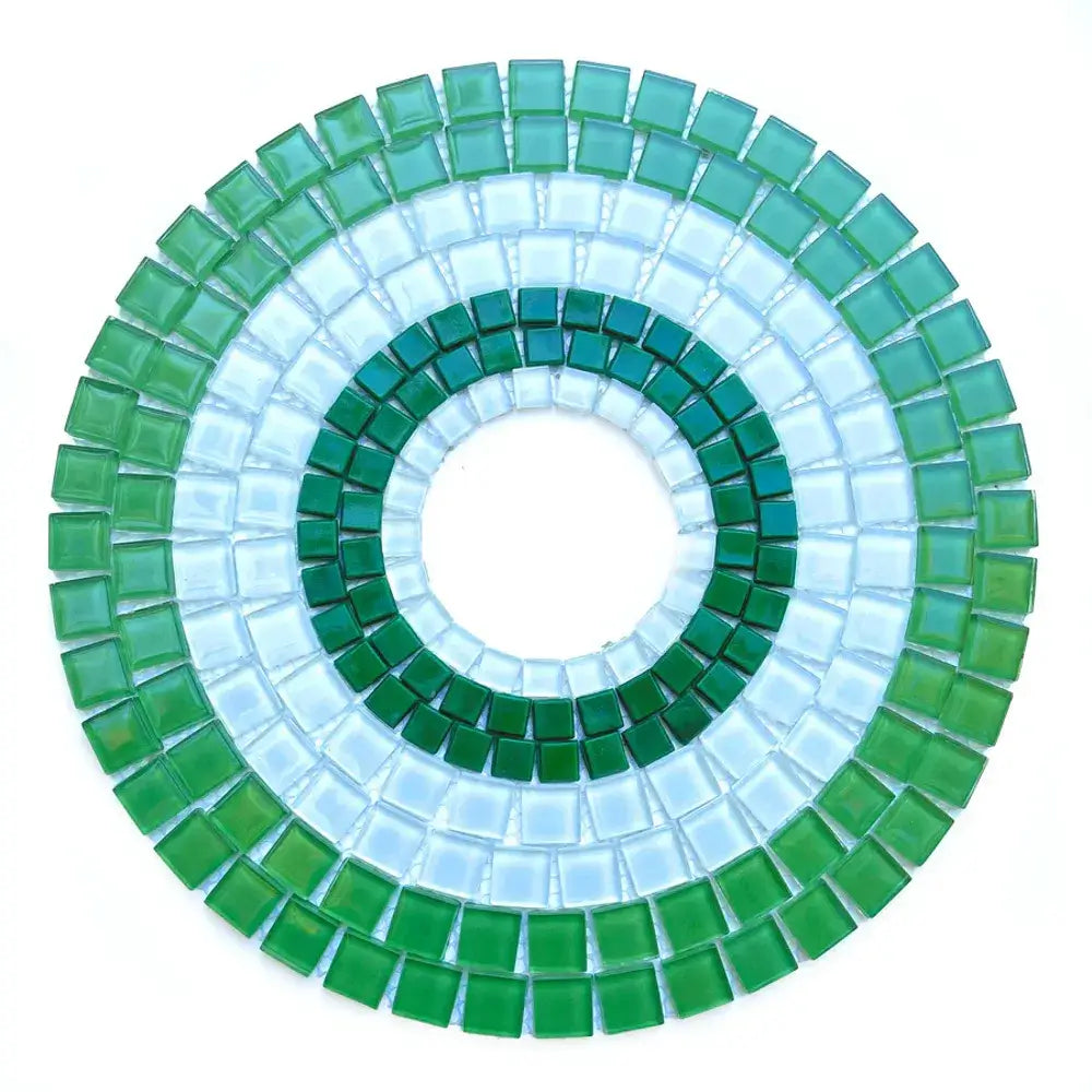 Circular mosaic design with green and blue tiles 