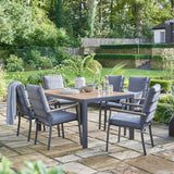 Garden dining set in garden on sunny day, the set is fully decorated.