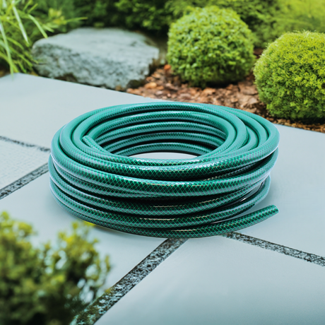 green hose pipe in garden