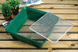 garden sieve in green on a table