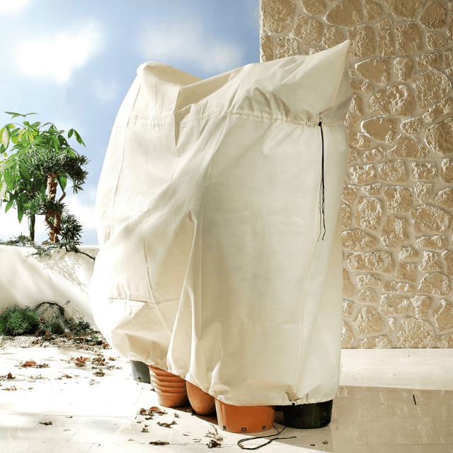 White heavy duty fleece covering plant pots