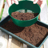 green garden sieve sieving mud