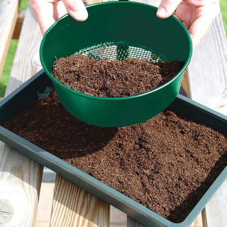 green garden sieve sieving mud