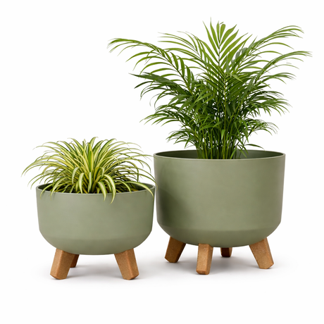 Two green planters with wooden legs on a white background