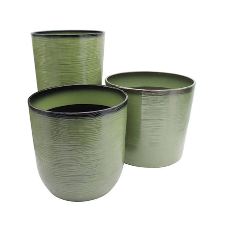 Three green ceramic planters with ribbed texture on a white background