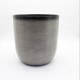 Gray textured flower pot on a white background