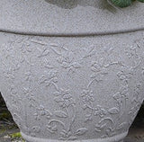 Design of grey garden pot stood in garden