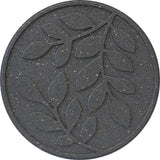 A round grey stepping stone with a leaf pattern design.