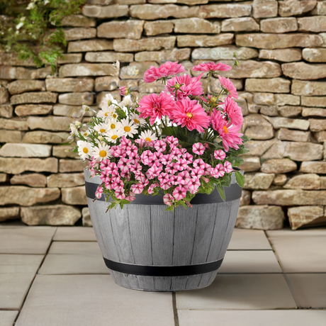 grey planter with flowers barrell effect