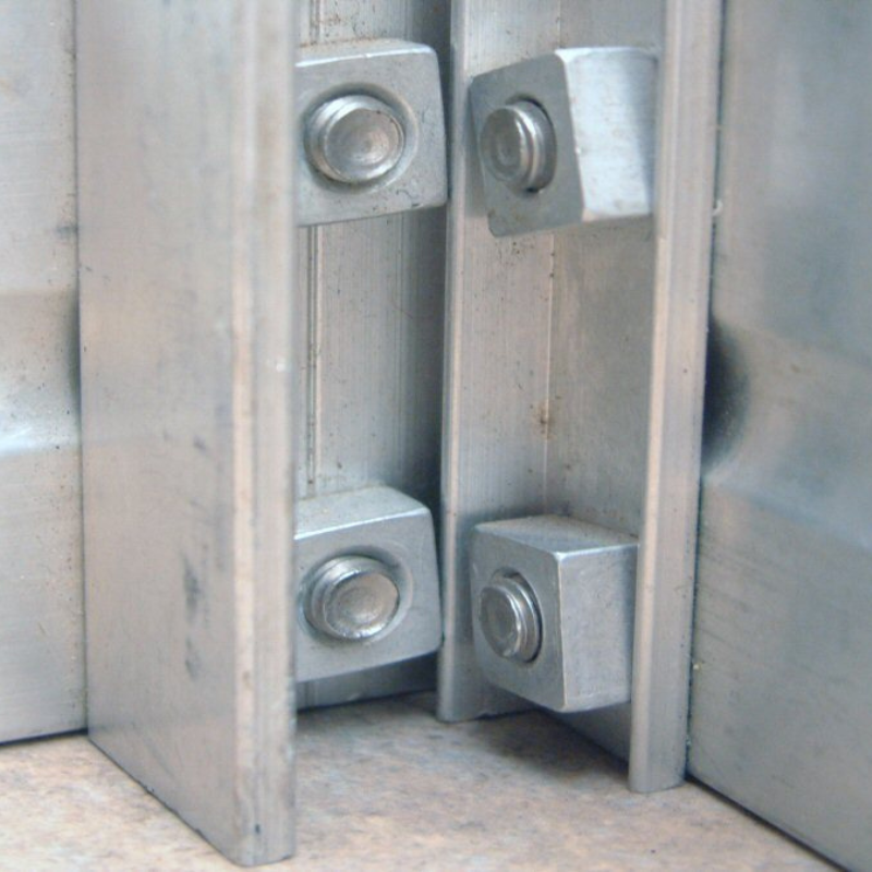 Close up of section of aluminium greenhouse and square fittings
