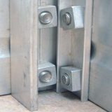 Close up of section of aluminium greenhouse and square fittings