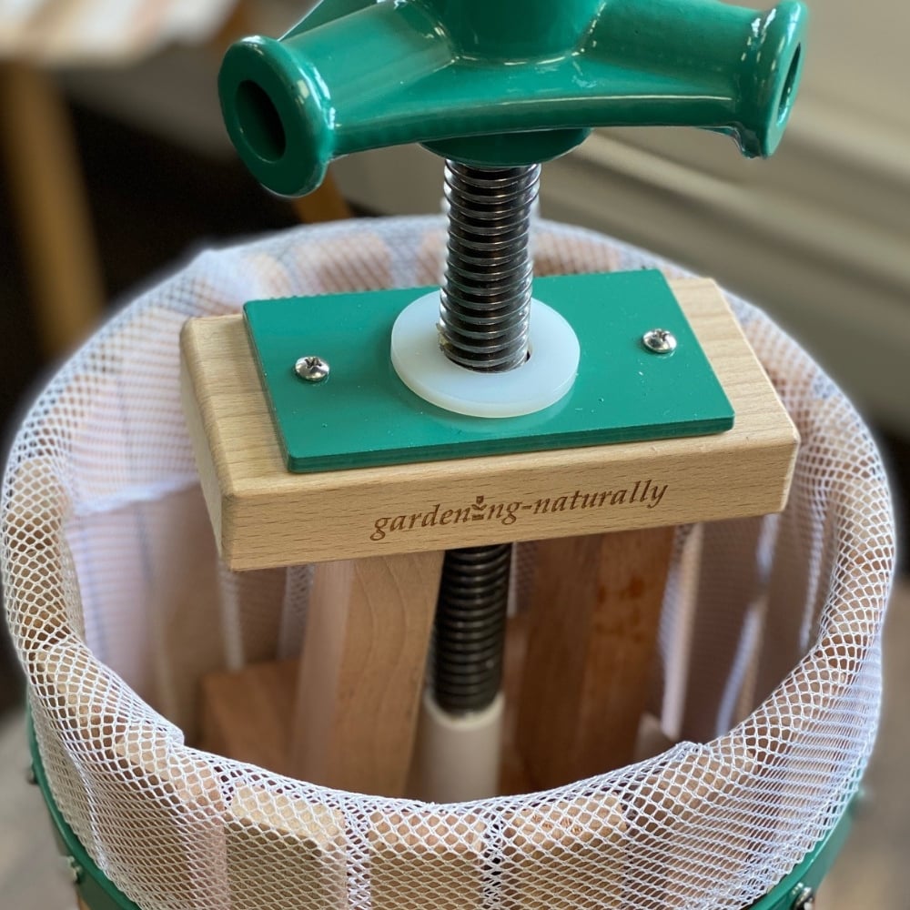 Gardening naturally fruit press handle showing logo