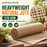 A roll of natural jute garden mat displayed on a wooden surface with a matching flat sheet spread out. 