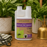 Houseplant spray concentrate bottle with a gold sprayer and plants in the background on a wooden surface.