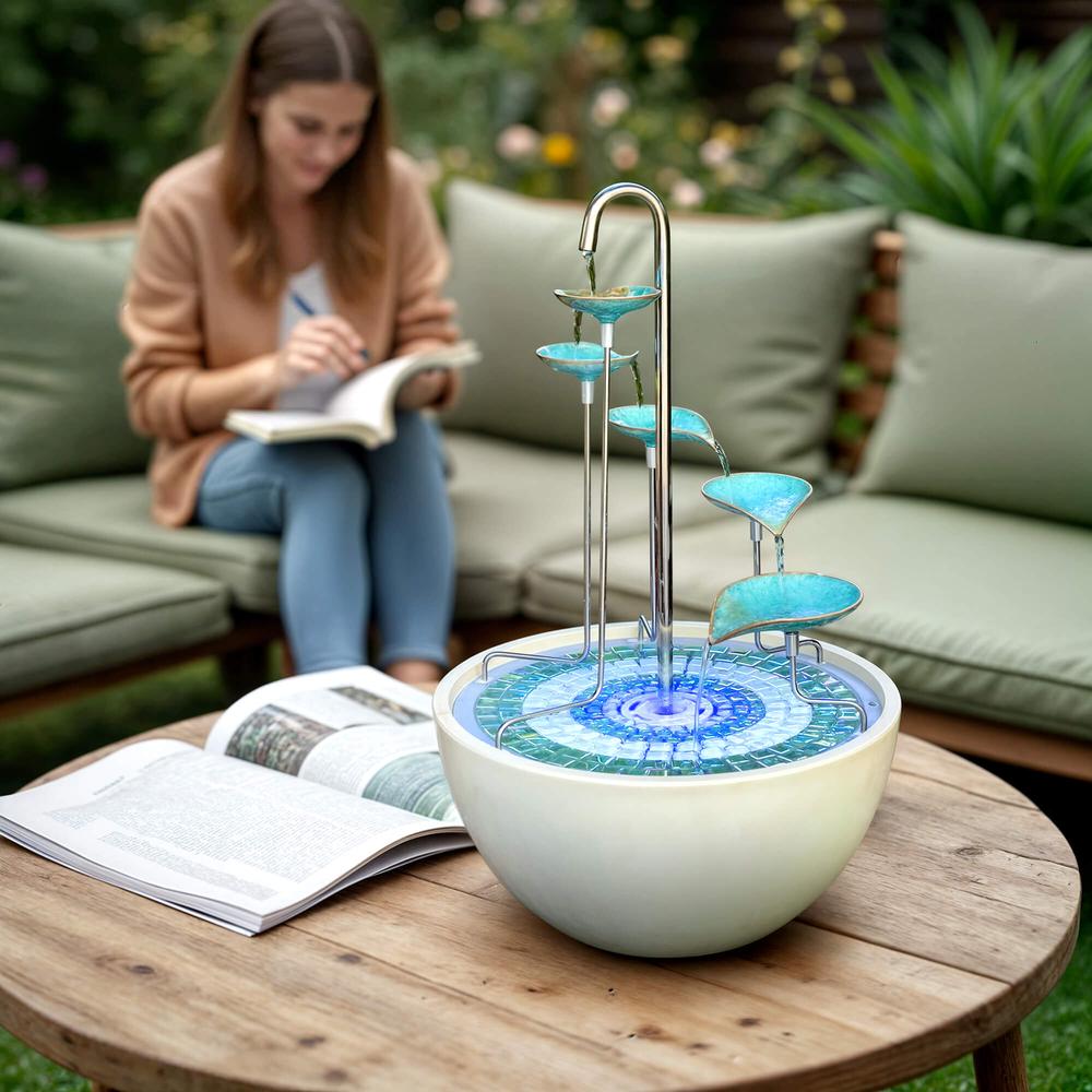 Small water fountain on a wooden table 
